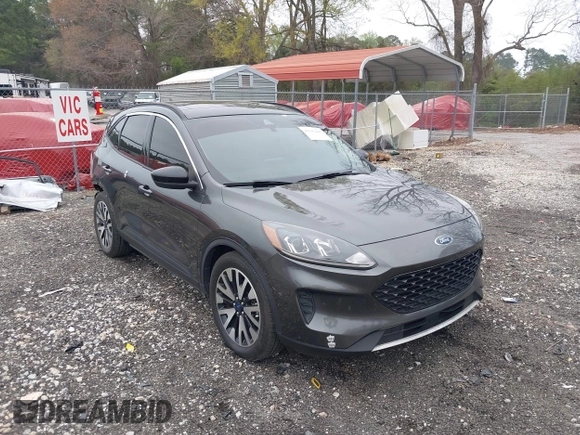 2020 Ford Escape SE Sport Hybrid with VIN 1FMCU0BZ7LUB13398, listed as a IAAI auction lot 41942498 with 118,604 mi miles and . Bid and sale history available at DreamBid. Image 1.