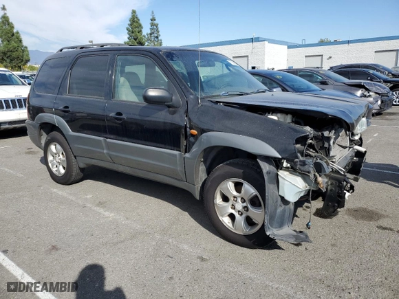 2001 Mazda Tribute LX with VIN 4F2YU09151KM38909, listed as a Copart auction lot 77808264 with 136,005 mi miles and Salvage Title. Bid and sale history available at carsss.com. Image 4.