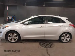 2013 Hyundai Elantra GT with VIN KMHD35LE2DU105677, listed as a IAAI auction lot 42027623 with 137,063 mi miles. Bid and sale history available at carsss.com. Image 14.