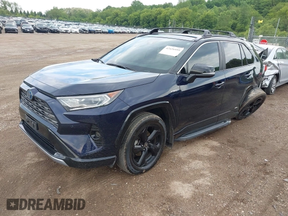 2021 Toyota RAV4 Hybrid XSE with VIN 4T3E6RFV0MU053245, listed as a IAAI auction lot 42426959 with 28,717 mi miles and . Bid and sale history available at DreamBid. Image 2.