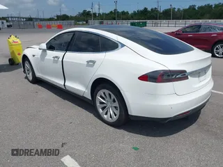 2014 Tesla Model S 60 with VIN 5YJSA1H12EFP39582, listed as a IAAI auction lot 42545143 with 117,383 mi miles and . Bid and sale history available at DreamBid. Image 3.