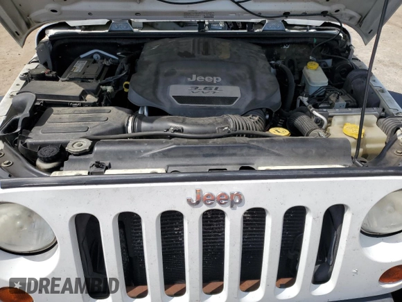 2013 Jeep Wrangler Unlimited Freedom z VIN 1C4BJWDG9DL542248, wystawiony jako Copart lot #58931345 z przebiegiem 215 667 mil mil oraz Czysty tytuł • Clean title. Historia ofert i sprzedaży dostępna na DreamBid. Obrazek 11.