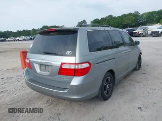 2005 Honda Odyssey TOURING with VIN 5FNRL38815B027811, listed as a IAAI auction lot 42105642 with 303,913 mi miles. Bid and sale history available at carsss.com. Image 4.