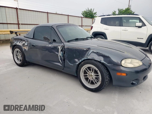 2001 Mazda MX-5 Miata with VIN JM1NB353210210976, listed as a Copart auction lot 59653695 with 152,250 mi miles and Salvage title. Bid and sale history available at DreamBid. Image 4.