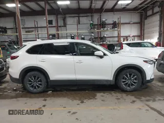 2020 Mazda CX-9 Touring z VIN JM3TCBCY8L0405360, wystawiony jako IAAI lot #41419428 z przebiegiem 69 917 mil mil oraz . Historia ofert i sprzedaży dostępna na DreamBid. Obrazek 13.