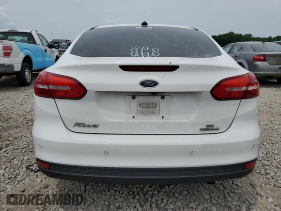 2016 Ford Focus SE with VIN 1FADP3F26GL287849, listed as a Copart auction lot 59980545 with 103,065 mi miles and Salvage title. Bid and sale history available at DreamBid. Image 6.
