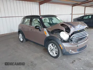 2012 MINI Countryman with VIN WMWZB3C51CWM04563, listed as a IAAI auction lot 42564564 with 95,760 mi miles and . Bid and sale history available at DreamBid. Image 1.