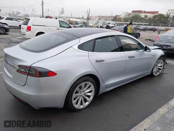 2016 Tesla Model S 70 with VIN 5YJSA1E17GF156514, listed as a IAAI auction lot 41869006 with 17,704 mi miles and . Bid and sale history available at DreamBid. Image 4.