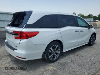 2023 Honda Odyssey Touring with VIN 5FNRL6H84PB016614, listed as a Copart auction lot 59336585 with 36,932 mi miles and Salvage title. Bid and sale history available at DreamBid. Image 3.