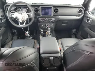 2023 Jeep Gladiator High Altitude z VIN 1C6HJTFG0PL571882, wystawiony jako Copart lot #86482234 z przebiegiem Nie podano mil oraz Szkoda całkowita • Salvage title. Historia ofert i sprzedaży dostępna na DreamBid. Obrazek 8.