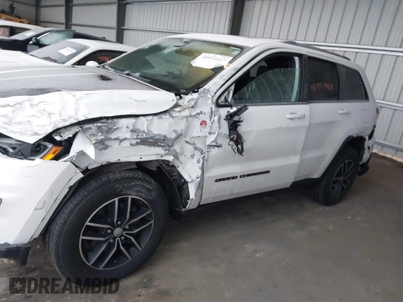 2018 Jeep Grand Cherokee Trailhawk with VIN 1C4RJFLGXJC264438, listed as a IAAI auction lot 40974417 with 117,717 mi miles and . Bid and sale history available at DreamBid. Image 14.
