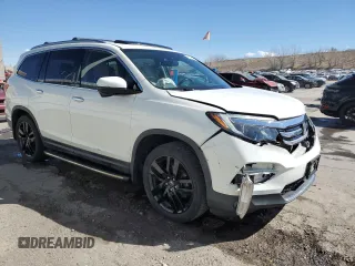 2017 Honda Pilot Touring with VIN 5FNYF6H91HB007611, listed as a Copart auction lot 47217175 with 107,349 mi miles and Salvage Title. Bid and sale history available at DreamBid. Image 4.