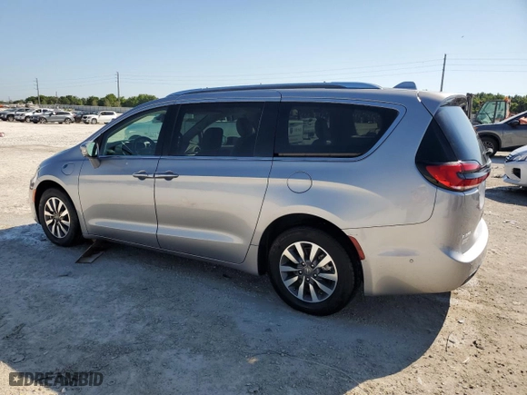 2021 Chrysler Pacifica Hybrid Touring L with VIN 2C4RC1L71MR594686, listed as a Copart auction lot 50885575 with 64,792 mi miles and Clean Title. Bid and sale history available at carsss.com. Image 2.
