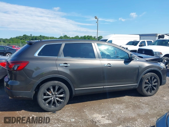 2015 Mazda CX-9 Grand Touring z VIN JM3TB3DV8F0465155, wystawiony jako IAAI lot #42366636 z przebiegiem 125 407 mil mil oraz . Historia ofert i sprzedaży dostępna na DreamBid. Obrazek 13.