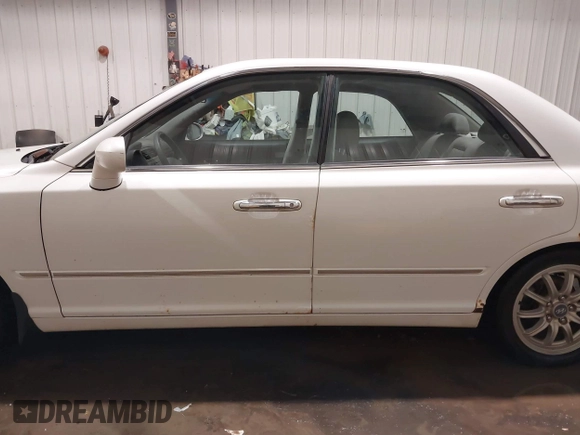 2002 Hyundai XG L z VIN KMHFU45EX2A180204, wystawiony jako IAAI lot #41472564 z przebiegiem 148 333 mil mil oraz . Historia ofert i sprzedaży dostępna na DreamBid. Obrazek 14.