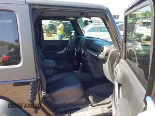 2015 Jeep Wrangler Rubicon Hard Rock with VIN 1C4BJWCG1FL610028, listed as a IAAI auction lot 42318569 with 48,627 mi miles and . Bid and sale history available at DreamBid. Image 5.