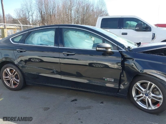 2016 Ford Fusion Energi Titanium with VIN 3FA6P0SU5GR401632, listed as a IAAI auction lot 41540328 with 116,087 mi miles. Bid and sale history available at carsss.com. Image 13.