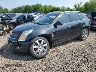 2011 Cadillac SRX Premium Collection z VIN 3GYFNFEY9BS606335, wystawiony jako Copart lot #59009285 z przebiegiem 152 828 mil mil oraz Szkoda całkowita • Salvage title. Historia ofert i sprzedaży dostępna na DreamBid. Obrazek 1.