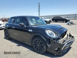 2017 MINI Hardtop Cooper S with VIN WMWXP7C52H2A44625, listed as a Copart auction lot 58011895 with 79,238 mi miles and Salvage title. Bid and sale history available at DreamBid. Image 4.