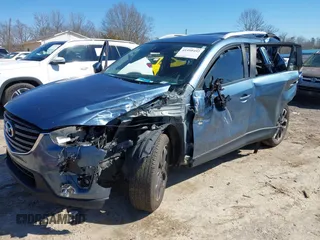 2016 Mazda CX-5 Grand Touring with VIN JM3KE2DY2G0715272, listed as a IAAI auction lot 41590492 with 134,176 mi miles. Bid and sale history available at carsss.com. Image 23.