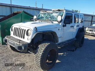 2016 Jeep Wrangler Unlimited Sahara with VIN 1C4BJWEG5GL243004, listed as a IAAI auction lot 40438321 with 121,360 mi miles and . Bid and sale history available at DreamBid. Image 2.