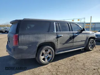2015 Chevrolet Suburban LT with VIN 1GNSKJKC2FR274506, listed as a Copart auction lot 87881695 with 196,506 mi miles and Salvage Title. Bid and sale history available at DreamBid. Image 3.