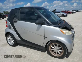 2009 Smart fortwo Pure z VIN WMEEJ31X69K280705, wystawiony jako Copart lot #73877374 z przebiegiem Nie podano mil oraz Nie do naprawy • Non repairable. Historia ofert i sprzedaży dostępna na DreamBid. Obrazek 4.