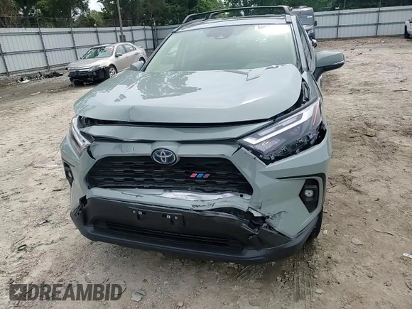 2023 Toyota RAV4 Hybrid XLE Premium with VIN JTMB6RFV8PD097109, listed as a Copart auction lot 59970995 with 43,197 mi miles and Salvage title. Bid and sale history available at DreamBid. Image 13.