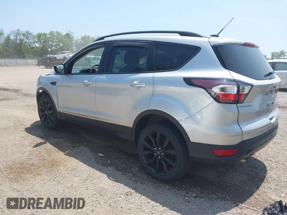 2017 Ford Escape SE z VIN 1FMCU9G95HUD37371, wystawiony jako IAAI lot #42393304 z przebiegiem 76 039 mil mil oraz . Historia ofert i sprzedaży dostępna na DreamBid. Obrazek 3.