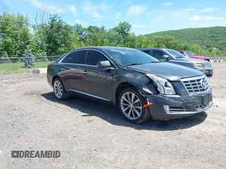 2013 Cadillac XTS Luxury z VIN 2G61R5S33D9101434, wystawiony jako IAAI lot #42290199 z przebiegiem 48 075 mil mil oraz . Historia ofert i sprzedaży dostępna na DreamBid. Obrazek 1.