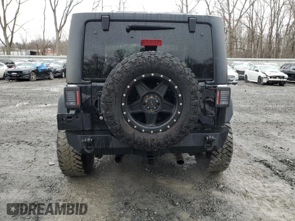 2014 Jeep Wrangler Sahara with VIN 1C4AJWBG0EL306703, listed as a Copart auction lot 51450215 with 115,932 mi miles and Salvage Title. Bid and sale history available at DreamBid. Image 6.