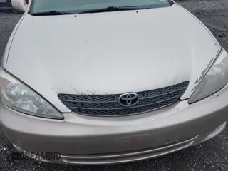 2004 Toyota Camry LE with VIN 4T1BE30KX4U327013, listed as a IAAI auction lot 41987105 with 241,236 mi miles. Bid and sale history available at carsss.com. Image 6.