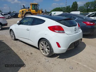 2013 Hyundai Veloster w/Black Int with VIN KMHTC6AD2DU131983, listed as a IAAI auction lot 42671646 with 131,731 mi miles and . Bid and sale history available at DreamBid. Image 3.