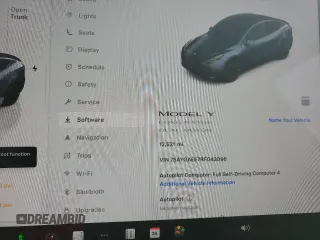 2024 Tesla Model Y Long Range with VIN 7SAYGAEE7RF043096, listed as a Copart auction lot 46939395 with 12,521 mi miles and Salvage Title. Bid and sale history available at DreamBid. Image 9.