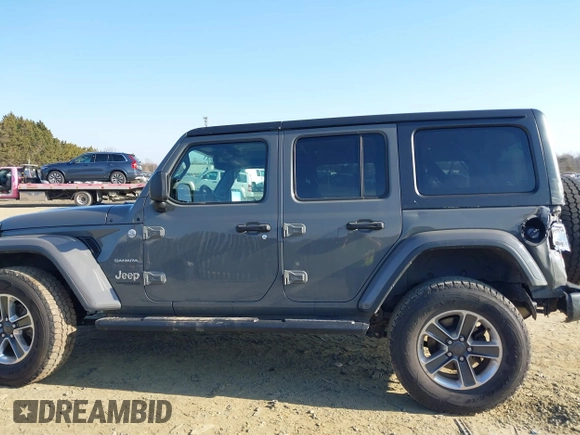 2018 Jeep Wrangler Unlimited Sahara with VIN 1C4HJXEN9JW303094, listed as a IAAI auction lot 41491564 with 66,128 mi miles and . Bid and sale history available at DreamBid. Image 14.