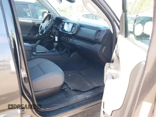 2023 Toyota Tacoma SR with VIN 3TMCZ5AN0PM614127, listed as a IAAI auction lot 41974924 with 12,674 mi miles and . Bid and sale history available at DreamBid. Image 5.