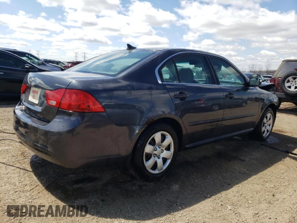 2010 Kia Optima LX z VIN KNAGG4A86A5451165, wystawiony jako Copart lot #52763415 z przebiegiem 213 958 mil mil oraz Szkoda całkowita • Salvage title. Historia ofert i sprzedaży dostępna na DreamBid. Obrazek 3.