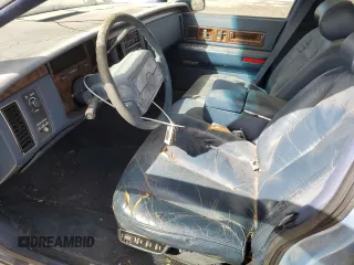 1993 Cadillac Fleetwood z VIN 1G6DW5278PR709811, wystawiony jako Copart lot #51678935 z przebiegiem 143 277 mil mil oraz Czysty tytuł • Clean title. Historia ofert i sprzedaży dostępna na DreamBid. Obrazek 7.