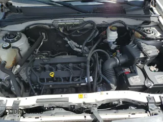 2010 Ford Escape Limited with VIN 1FMCU0E77AKC58458, listed as a Copart auction lot 64207645 with 160,650 mi miles and Salvage title. Bid and sale history available at DreamBid. Image 12.