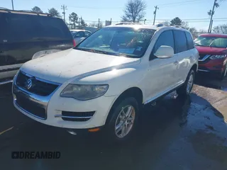 2008 Volkswagen Touareg V6 with VIN WVGBE77L48D033523, listed as a IAAI auction lot 41076281 with 202,286 mi miles and . Bid and sale history available at DreamBid. Image 2.