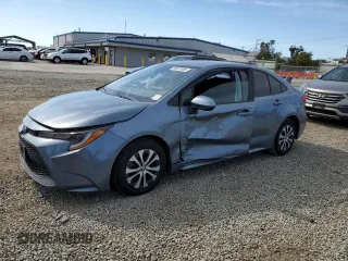 2022 Toyota Corolla Hybrid LE with VIN JTDEAMDE0N3003048, listed as a Copart auction lot 50637085 with 67,990 mi miles and Salvage Title. Bid and sale history available at carsss.com. Image 1.