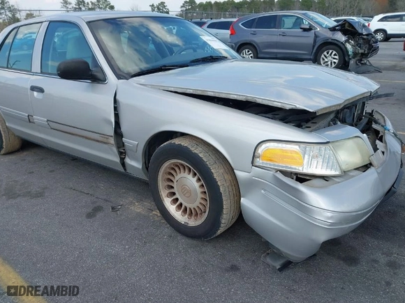 2004 Ford Crown Victoria Standard with VIN 2FAFP73W94X107561, listed as a IAAI auction lot 41804985 with 128,066 mi miles. Bid and sale history available at carsss.com. Image 13.