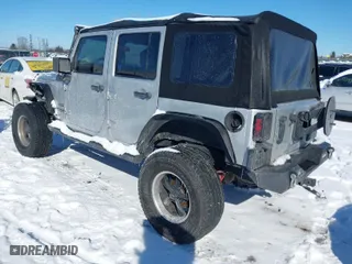 2010 Jeep Wrangler Unlimited Sport with VIN 1J4BA3H11AL102891, listed as a IAAI auction lot 41576869 with 213,204 mi miles. Bid and sale history available at carsss.com. Image 3.
