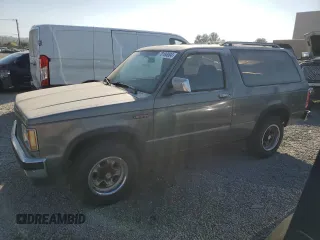 1988 GMC Jimmy z VIN 1GKCS18Z2J8541042, wystawiony jako Copart lot #78100004 z przebiegiem 199 916 mil mil oraz Czysty tytuł • Clean title. Historia ofert i sprzedaży dostępna na DreamBid. Obrazek 1.