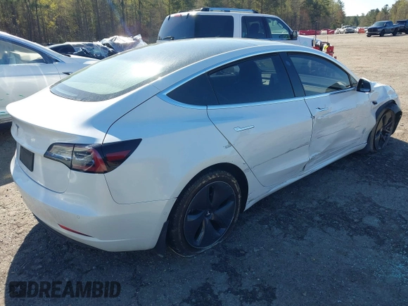 2020 Tesla Model 3 Standard Range Plus with VIN 5YJ3E1EA7LF797150, listed as a IAAI auction lot 41869088 with 75,708 mi miles and . Bid and sale history available at carsss.com. Image 4.