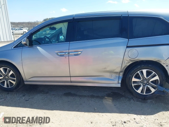 2016 Honda Odyssey Touring Elite with VIN 5FNRL5H96GB090653, listed as a IAAI auction lot 41720195 with 68,969 mi miles. Bid and sale history available at carsss.com. Image 14.