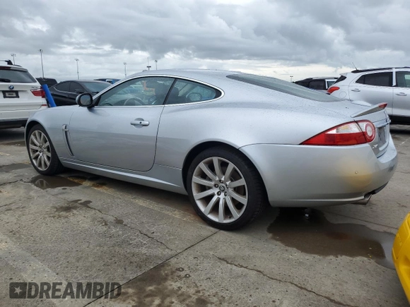 2007 Jaguar XK with VIN SAJWA43B475B12815, listed as a Copart auction lot 75012064 with 55,917 mi miles and Salvage Title. Bid and sale history available at carsss.com. Image 2.