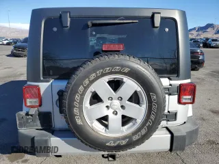 2007 Jeep Wrangler Unlimited Sahara with VIN 1J4GB59197L144781, listed as a Copart auction lot 48678315 with 137,538 mi miles and Salvage title. Bid and sale history available at DreamBid. Image 6.