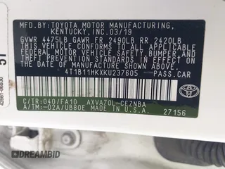 2019 Toyota Camry LE z VIN 4T1B11HKXKU237605, wystawiony jako IAAI lot #42248386 z przebiegiem 70 235 mil mil oraz . Historia ofert i sprzedaży dostępna na DreamBid. Obrazek 9.