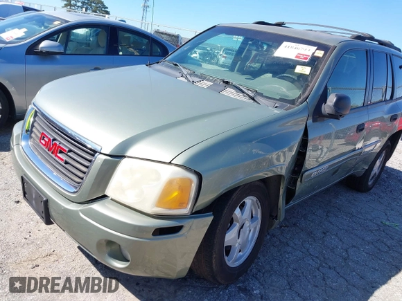 2003 GMC Envoy SLT with VIN 1GKDS13S432373988, listed as a IAAI auction lot 41840744 with 221,306 mi miles. Bid and sale history available at carsss.com. Image 6.